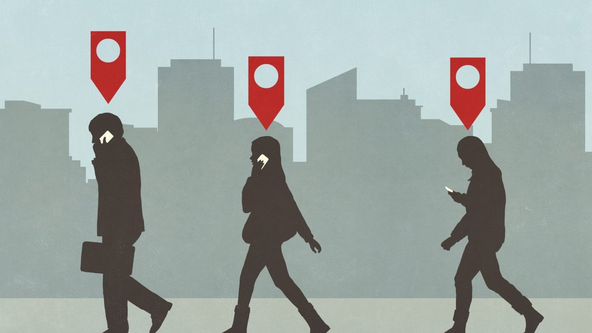 Map pin icons above business people walking and talking on smart phones in city