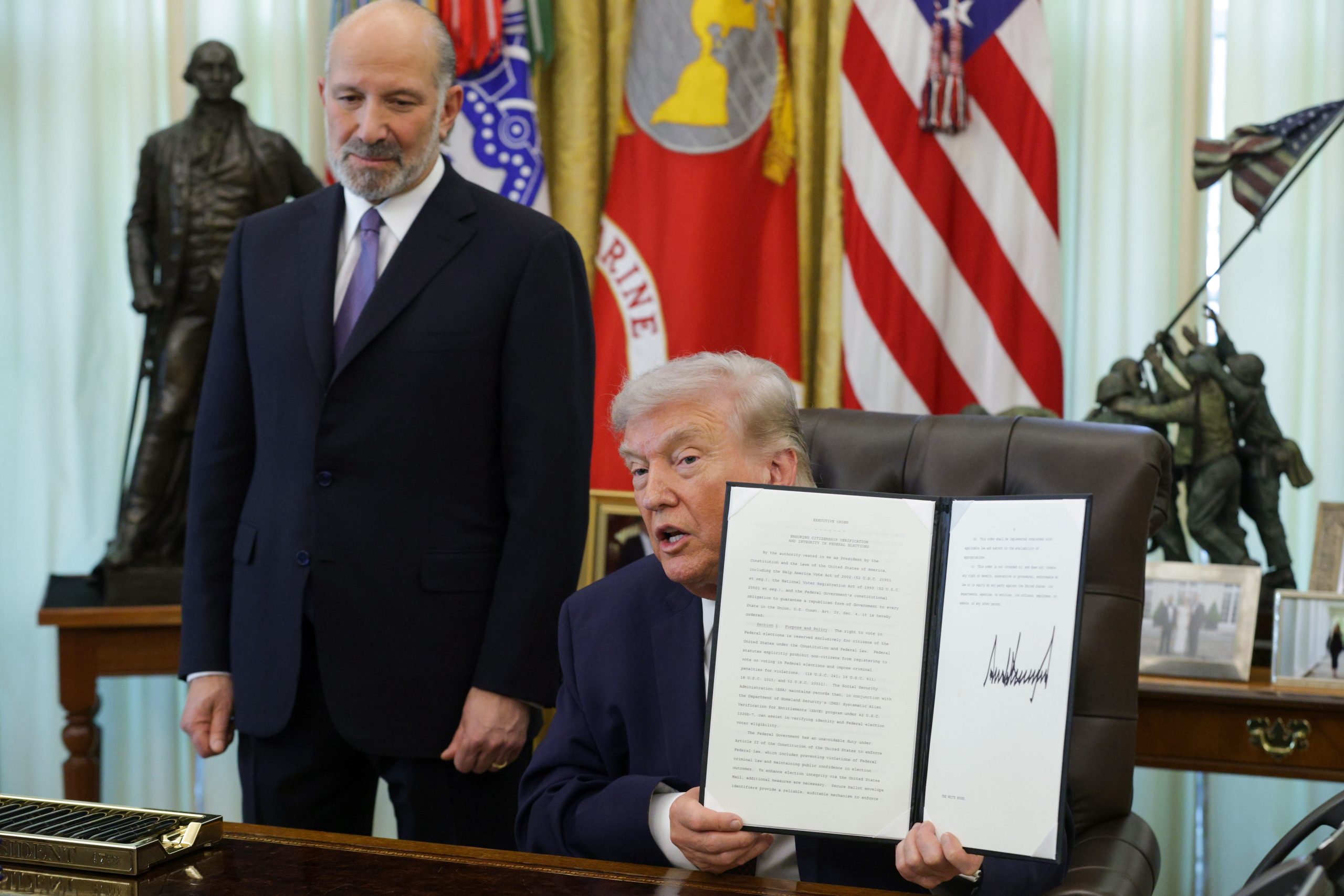 A federal judge in Boston blocks key parts of Trump’s order to limit voting by mail