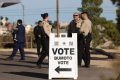 As American elections become more tense, officials are turning to local police