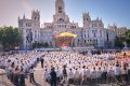 1 million people flood Madrid streets to see the pope’s flower-carpeted procession