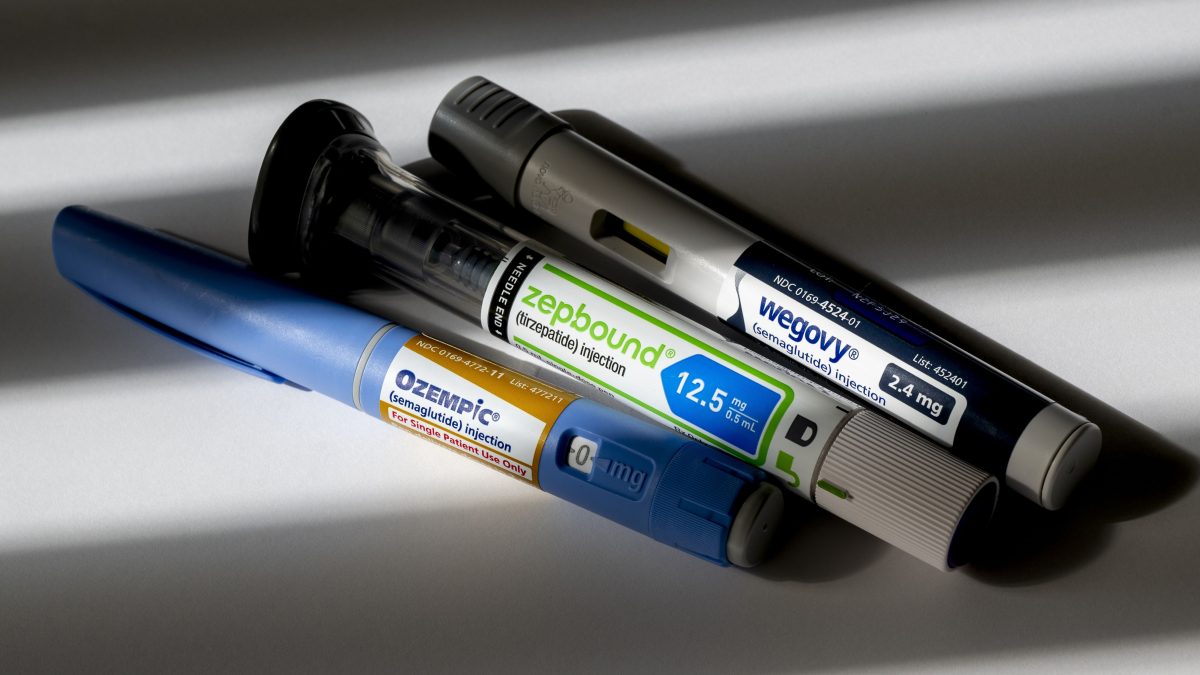 photo illustration of a group of weight loss injection pen medications.